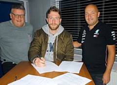 Jake Sandham (centre) signing as Norden Cricket Club's professional in 2019, will not return for 2021