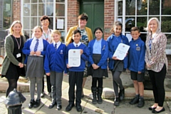 The school children with, from left to right, Jeni Smith of St Andrews, Liz McIvor from Rochdale Pioneers Museum, Cllr Janet Emsley and Miss J Traynor from Caldershaw