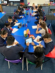 The children writing their letters to Rochdale's fallen soldiers