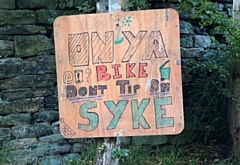 A sign warning people not to fly-tip on Syke