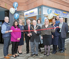 Deputy Mayor Billy Sheerin cuts the ribbon, with Lorenzo O'Reilly, Alima Ahmed, Kim Fazackerley, Rochdale MP Tony Lloyd, Rachel Byrne, Toni Smith, Amanda Wrigglesworth, Paul Ambrose, and Allen Brett, Leader of the Council