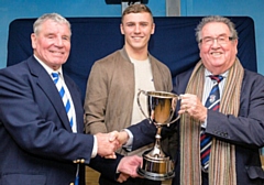 President of Mayfield RLFC Mr Barry Edwards and the son of Steve Gartland, Mr Brad Gartland presenting the Steve Gartland Memorial trophy to Chairman of Rochdale Hornets, Peter Rush