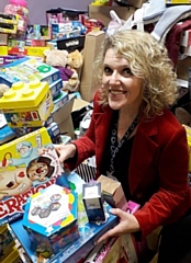 Giving Back Charity Member Helen Walton helping sort the gifts last year