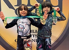 Collin and Andrew Perez show off their medals