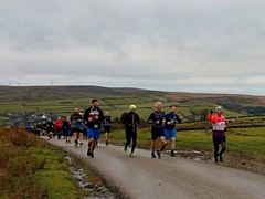 Simon Hall (far right) has raised £8,000 for charity by running thousands of miles. Pictured during his final run of 2018 on Whitworth Rake