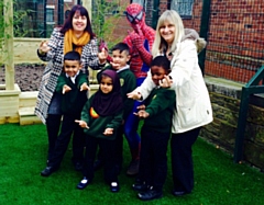 Staff and children with Spiderman