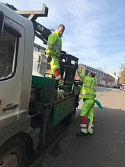 Council workers unload one of the new bins on Rooley Moor Road