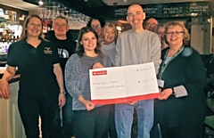 Garry Bower presents a cheque to Springhill Hospice 