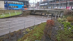 River Roch in Rochdale town centre is dangerously high, with the river just inches/centimetres from the top of the of the bridge at One Riverside and Rochdale bus station - 3.00pm Saturday 16 March 2019