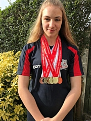 Lucy Cannavan with her medals