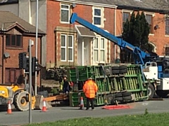 A trailer carrying heavy machinery overturned 