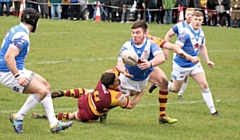 Cole Connolly, Mark Biggins and Zac Baker make the tackle all hoping to make it through to the fourth round of the Coral Challenge Cup