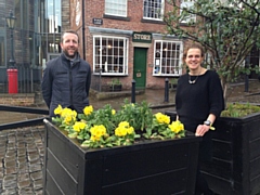 Cat Jessop with Paul Ambrose, of Rochdale Town Centre Management, by one of the planters earlier this year