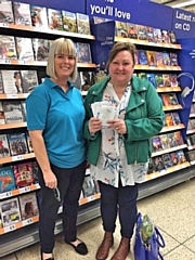 Louise Kershaw, from Crimble Croft Community Centre, receiving a months’ worth of food vouchers from Angie Gilbertson, of the SG6 Foundation, on behalf of a member of the local community.
