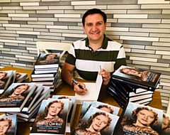 Sebastian Lassandro with copies of his books