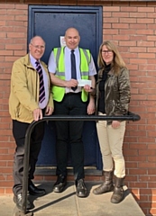 Committee members George Kinder and Janice Brooks receiving the sponsorship cheque from Daniel Scott (centre) of Robert Scott & Sons