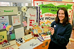 Local artist Sophie Bullock on the Rochdale stall at the event with the art and jigsaw piece created by the young people