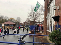 Alkrington Primary School doing The Daily Mile with headteacher, Tim Barnes, using a megaphone