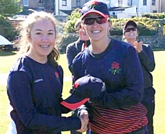 Olivia Thomas presented with her cap from Kate Cross