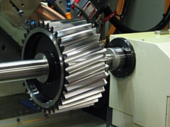 Precision grinding of a large face width pinion gear