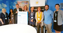 Richard Caulfield, Mental Health lead at the Association of Colleges signs the charter with Julia Heap, Hopwood Hall College staff and Clinical Psychologists from the Nurture-Psychology Service