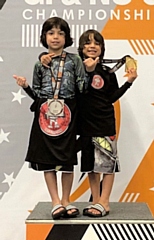 Andrew (left) and Collin Perez (right) with their medals at the BJJ Junior World Championships