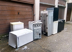 Fridges have been left outside the garages of Tentercroft on College Bank