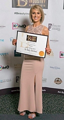 Lucy Atherton, owner of The Beauty Establishment, celebrating her Greater Manchester Five Star Beauty Salon of the Year Award win