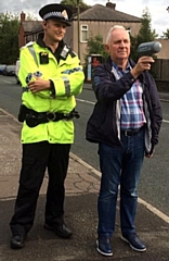 Councillor Ashley Dearnley and a police officer with a speed detection device