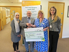 Retired mayor, Councillor Mohammed Zaman, presented a cheque of £10,000 to Springhill Hospice