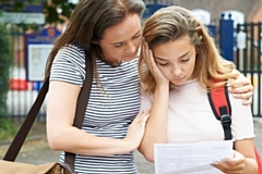 Girls worried about exam results (posed by models)