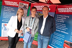 Thomas Braid receiving his prize from Vicki Butler-Henderson and Quentin Willson 