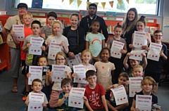 Councillor Janet Emsley (back left) celebrates the successful Fit, Feed and Read scheme with children and staff at Langley Library 