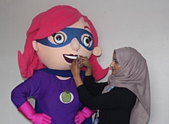 Rochdale's Healthy Hero Rochelle having her nasal flu vaccination to protect her from the flu this winter