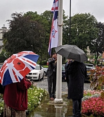 Deputy Mayor of Rochdale, Councillor Aasim Rashid, raises the flag  