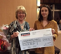 Janice Leonard, Lady Captain of Rochdale Golf Club, presenting a cheque to Danielle Freeman of The Alzheimer's Society