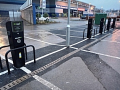 Electric vehicle charging posts on the car park of the Travelodge at Sandbrook Park