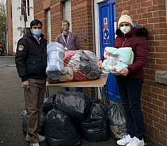 Councillor Faisal Rana and Iram Faisal hand over the blankets to Petrus manager Edmund