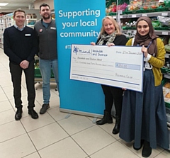 The cheque was presented by the two store managers, Chris Holt and Chris Lucas, and member pioneer, Bev Place to Sabba Razzaq from Rochdale and District Mind