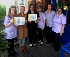 Councillor Pat Dale (second left), the council's assistant cabinet member for adult care, congratulates staff at Highfield Manor on the award