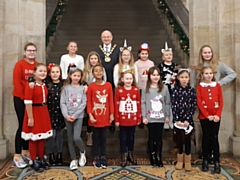 Mayor Billy Sheerin had afternoon tea with children who helped pack bags at local stores over Christmas