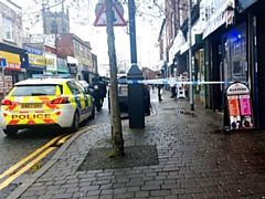 Police cordon outside Unique Barbers