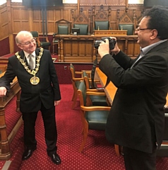 Councillor Iftikhar Ahmed, cabinet member for adult care (right) snaps the Mayor of Rochdale, Councillor Billy Sheerin