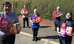 Councillor Faisal Rana hands over the Easter eggs to some of the nurses based at the Rochdale West Neighbourhood team at Willbutts Lane, Rochdale