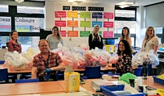 Staff at Cardinal Langley RC High School with donated visors