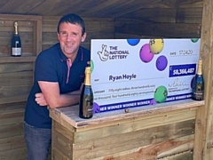 Ryan Hoyle with his EuroMillions jackpot cheque