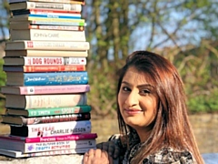 Zanib Iqbal, Volunteer Coordinator at Advocacy Focus, with a selection of books donated to support the charity’s Pen-demic Pals project