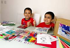 Hollin Primary pupils with their Get Creative Inside activity pack from Cartwheel Arts