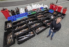 Sergeant Paul Nolan with the knives placed in Forever Amnesty bins