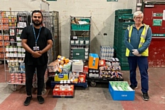 Mr Abdullah from Falinge Park High School delivers supplies to John Rowe at Rochdale Foodbank